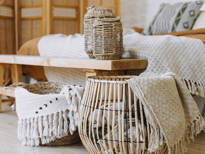 Fiber baskets at the foot of the bed.
